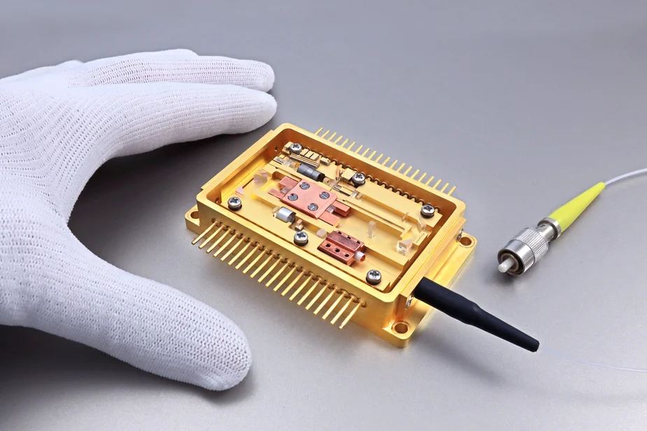 Gold-colored housing with optical fiber connection