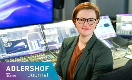 Woman in front of a mixing desk