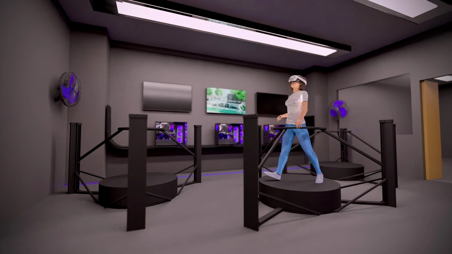 A woman wearing VR glasses walks on a rotating, round platform, several of which are located in a room.