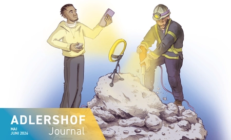 A construction worker is using a jackhammer to break up rocks, whilst a teenager films himself with a smartphone and a ring light