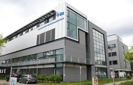 Building façade featuring the IKZ logo
