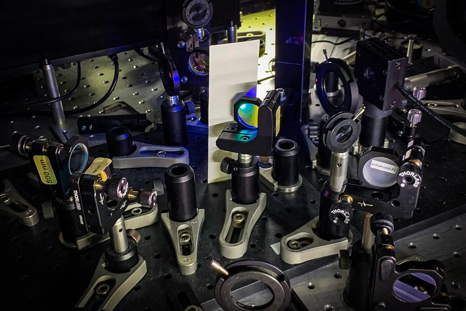 Table with various optical components mounted on it
