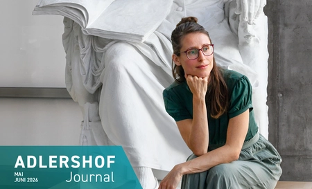 Heidi Mauersberger sitting in front of a plaster statue